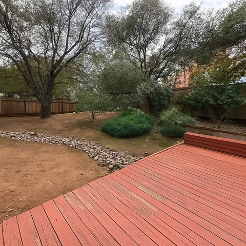 a backyard of a house with lots of green space
