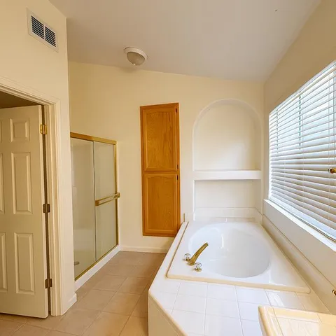a picture of a bathtub in a room