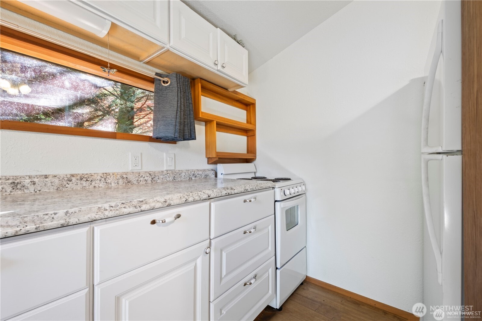 14310 200th Avenue Southeast Renton, WA 98058 - Photo 14 of 39 a bathroom with a granite countertop sink and a window