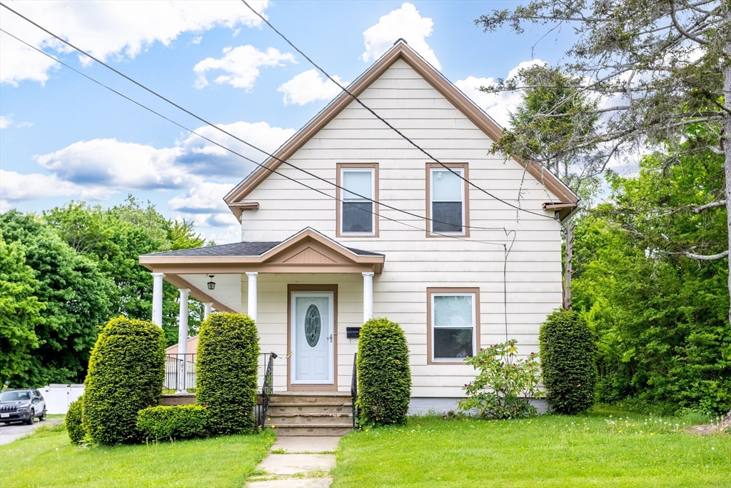 54 Charles Street Gardner, MA 01440 - Photo 2 of 40 a front view of a house with a yard