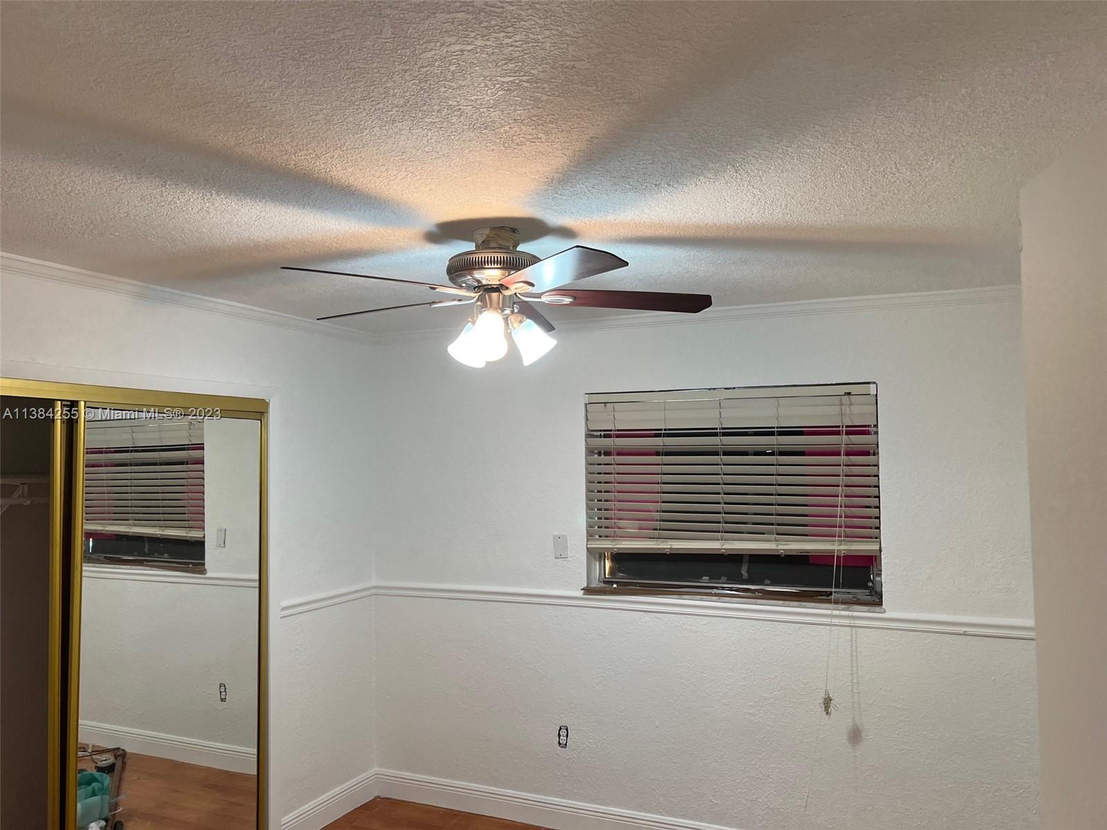 430 East 29th Street, Unit FRONT Hialeah, FL 33013 - Photo 11 of 17 a view of a livingroom with a fan