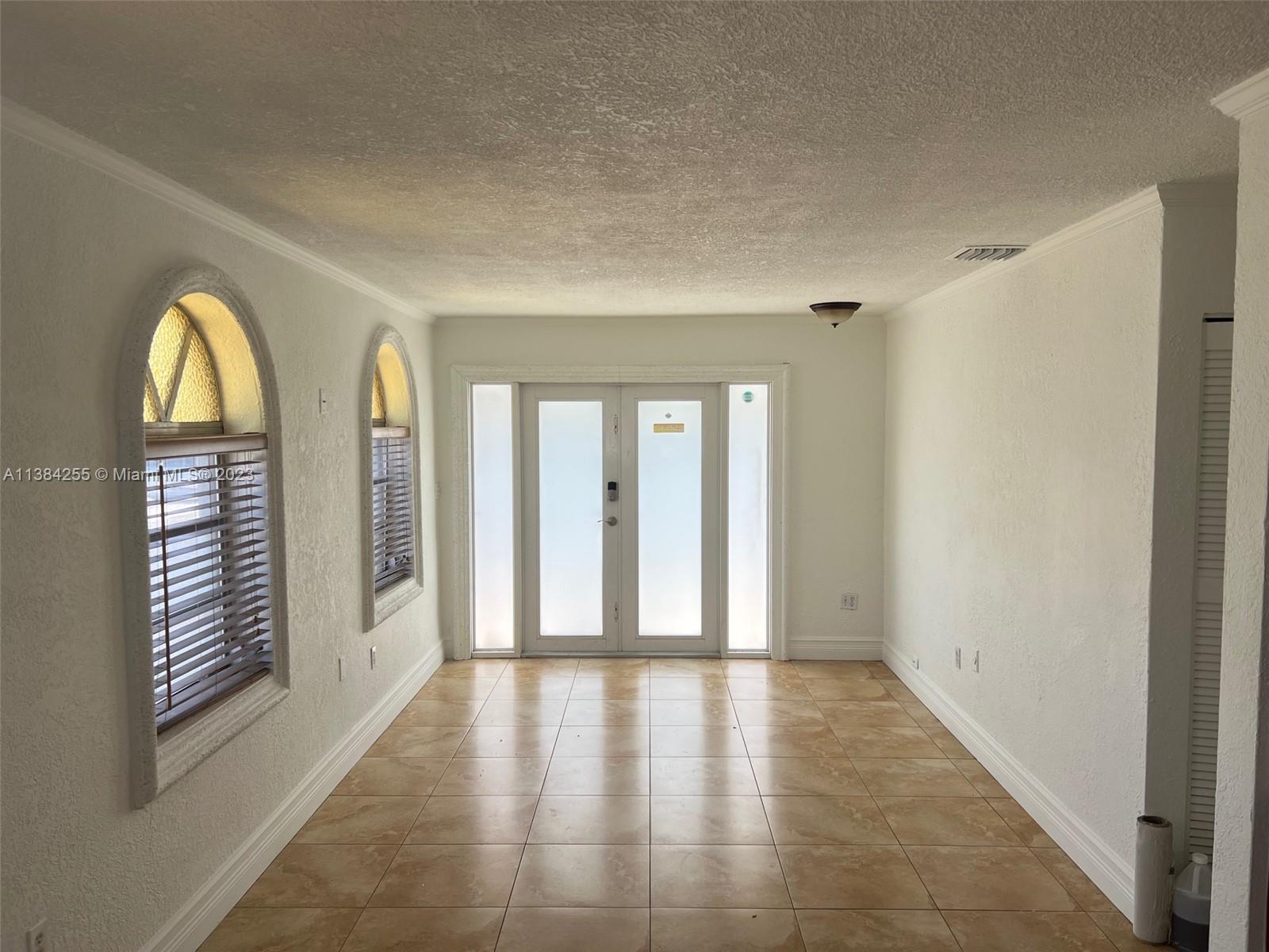 430 East 29th Street, Unit FRONT Hialeah, FL 33013 - Photo 3 of 17 a view of an entryway with wooden floor