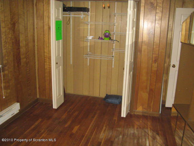 1040 Reservoir Road Moscow, PA 18444 - Photo 4 of 6 wooden floor in an empty room