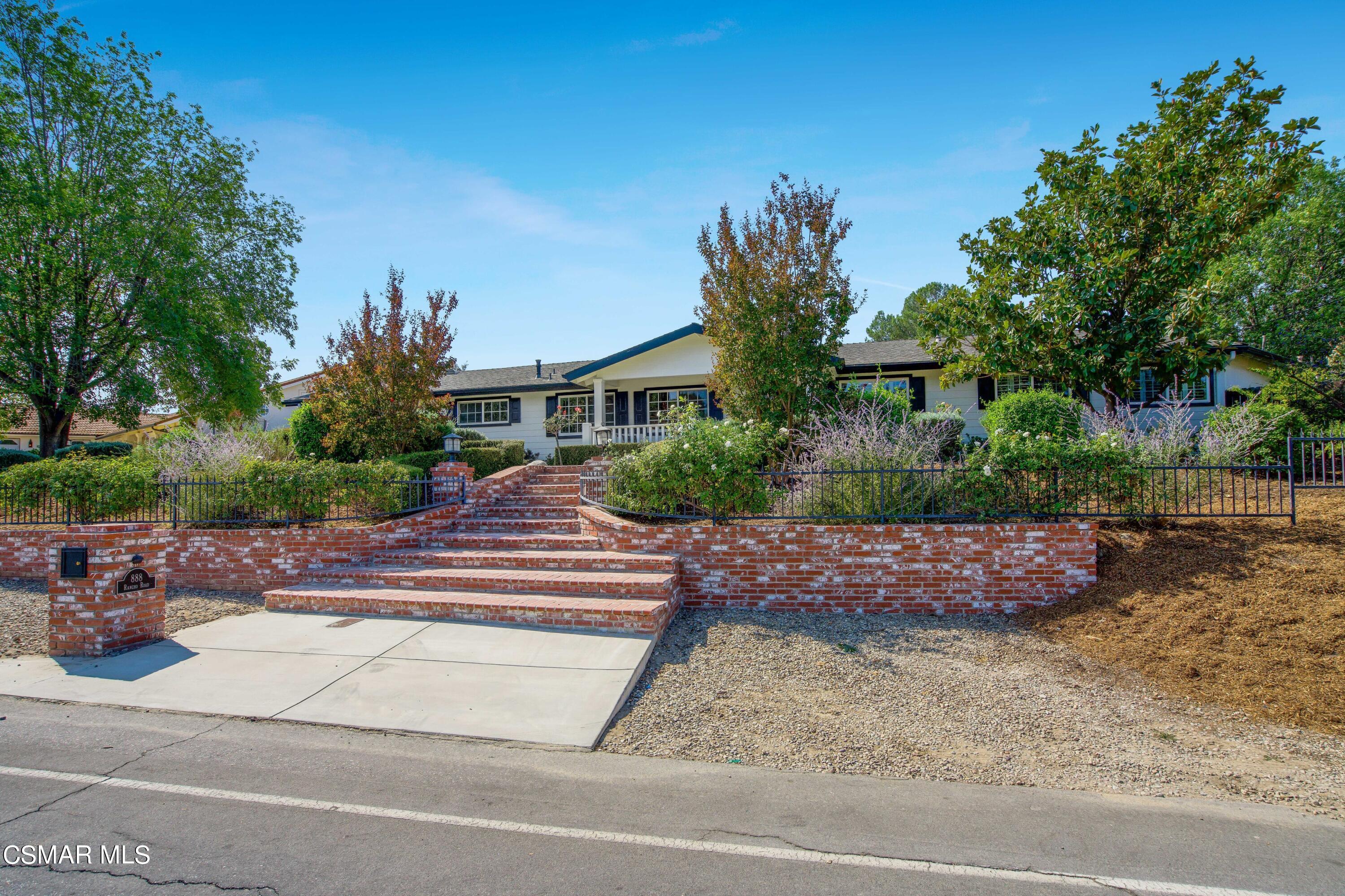 888 Rancho Road Thousand Oaks, CA 91362 - Photo 2 of 44 a front view of a house with porch