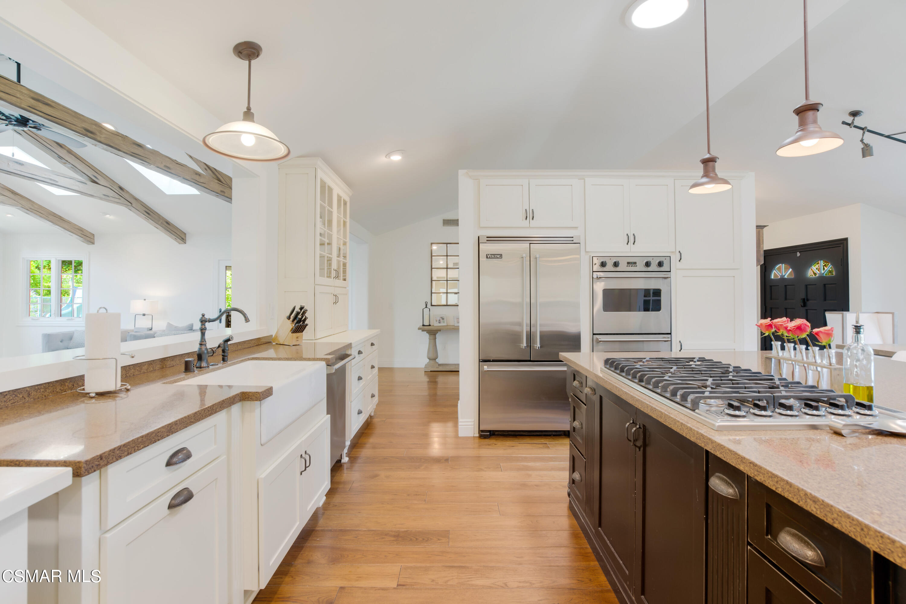 888 Rancho Road Thousand Oaks, CA 91362 - Photo 12 of 44 a large kitchen with kitchen island a large island in the center and stainless steel appliances