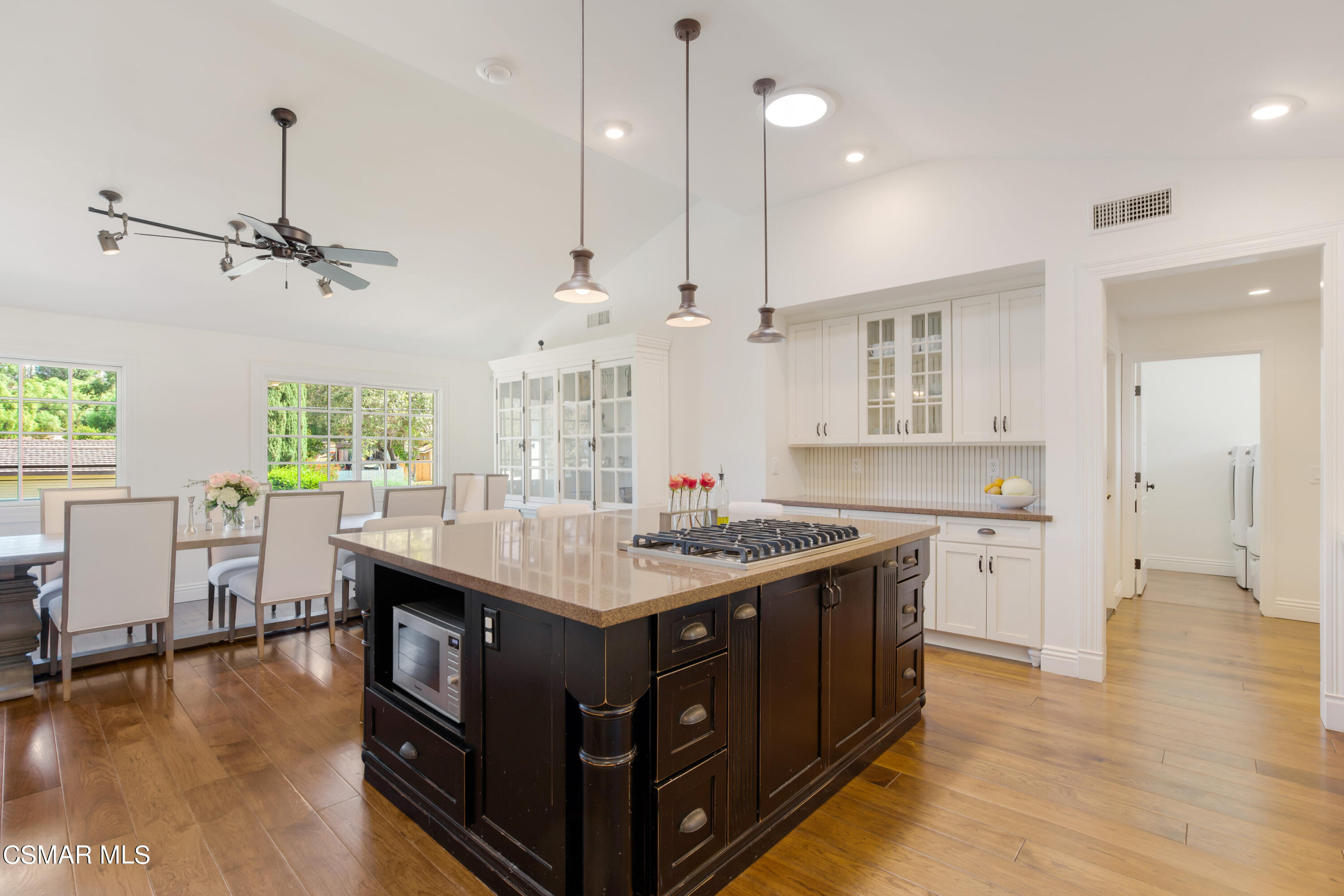 888 Rancho Road Thousand Oaks, CA 91362 - Photo 14 of 44 a kitchen with a stove a window and chairs