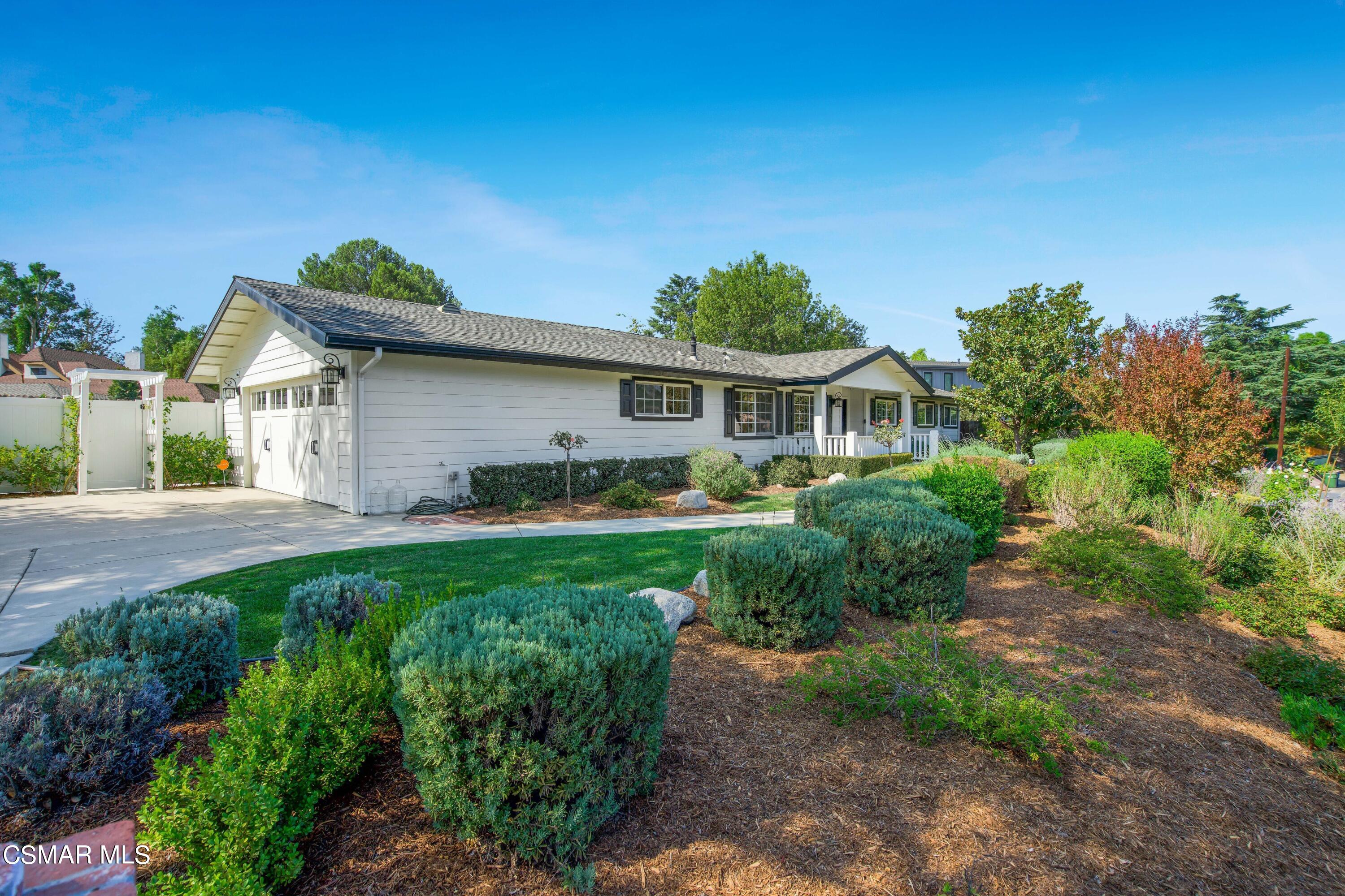 888 Rancho Road Thousand Oaks, CA 91362 - Photo 3 of 44 a front view of a house with a yard