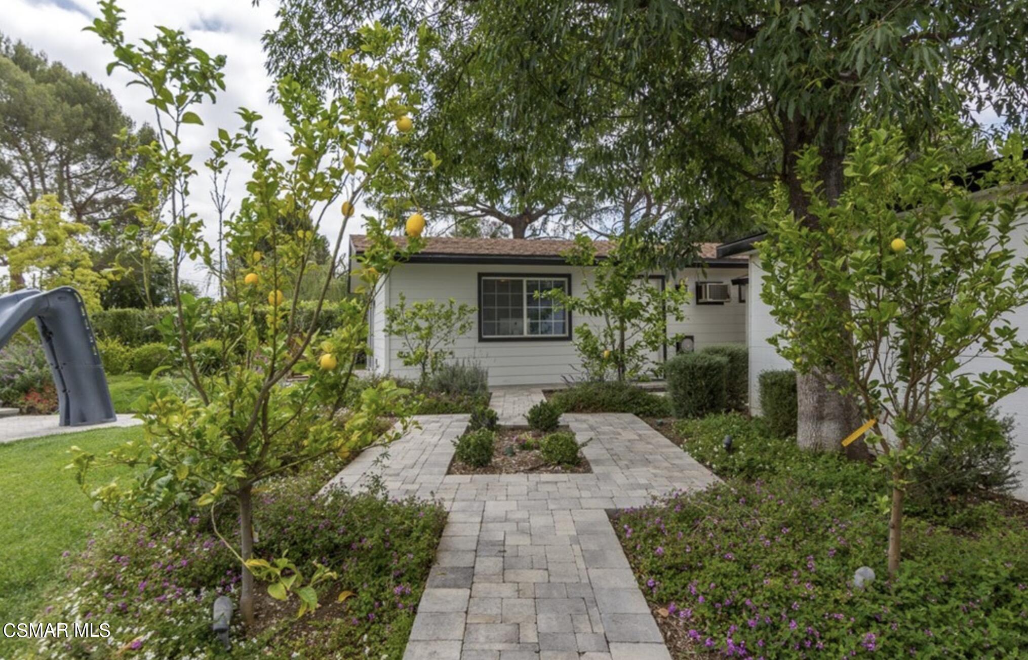888 Rancho Road Thousand Oaks, CA 91362 - Photo 29 of 44 a view of a house with backyard