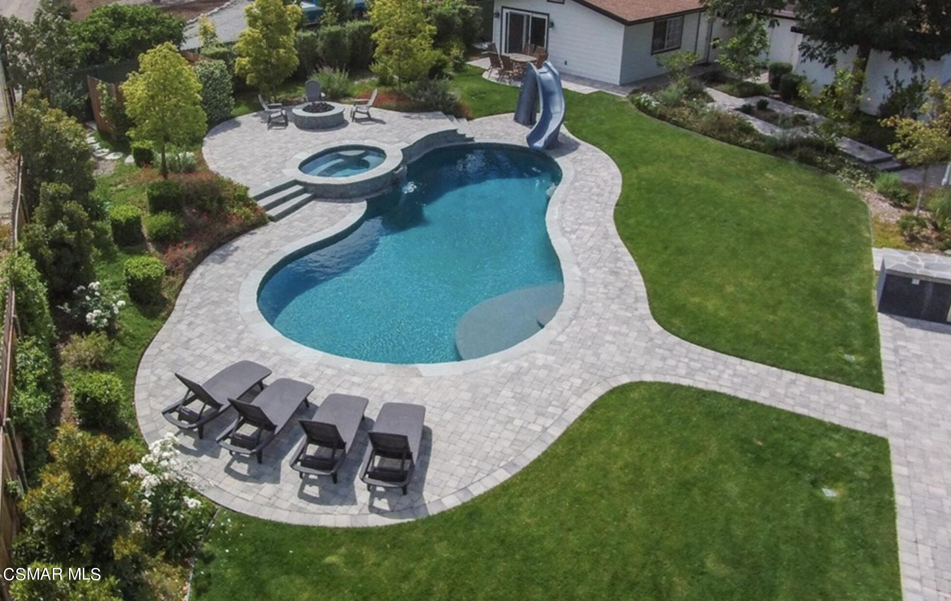 888 Rancho Road Thousand Oaks, CA 91362 - Photo 4 of 44 a view of a swimming pool with a yard and plants
