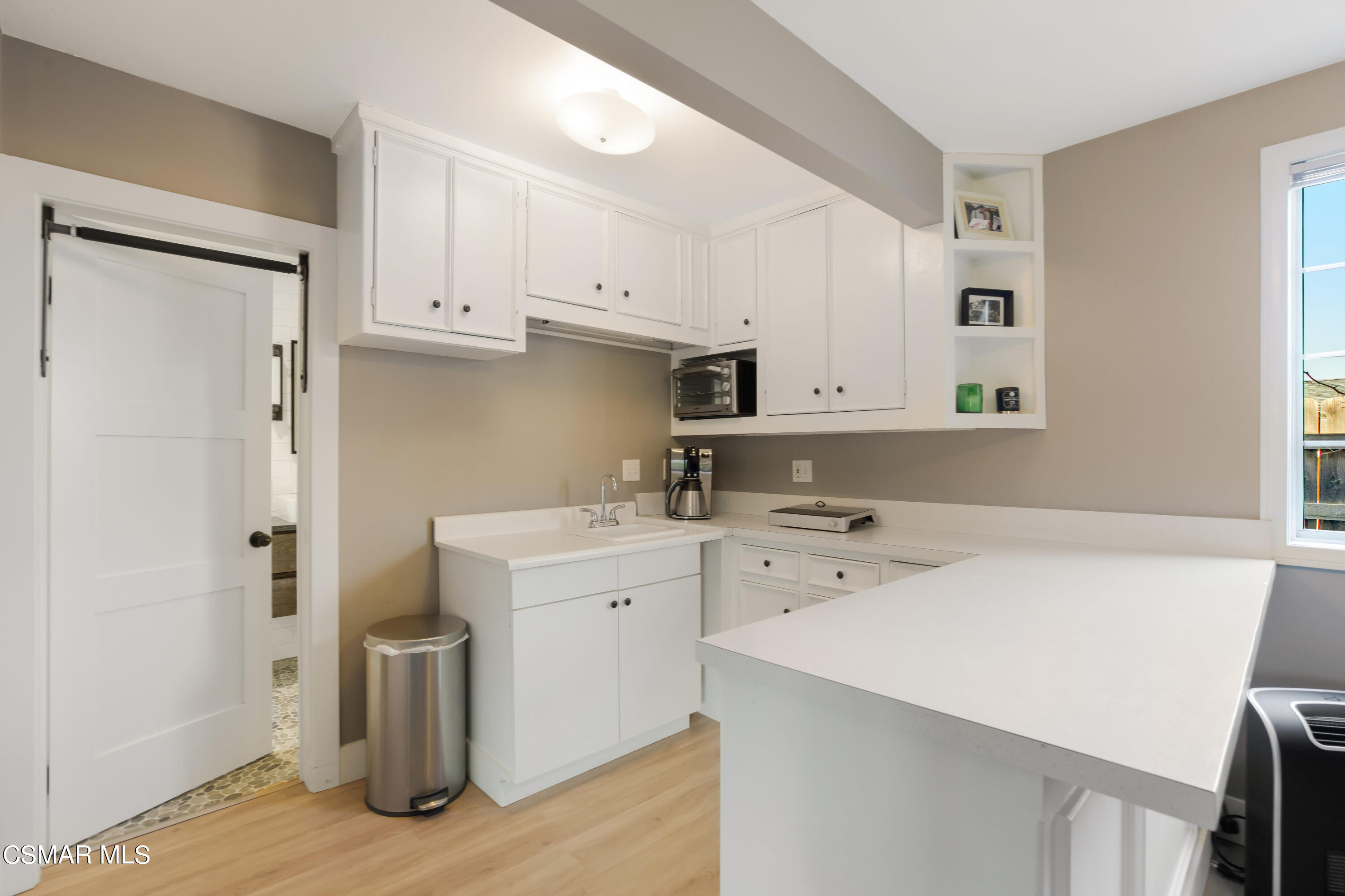 888 Rancho Road Thousand Oaks, CA 91362 - Photo 32 of 44 a utility room with cabinets washer and dryer