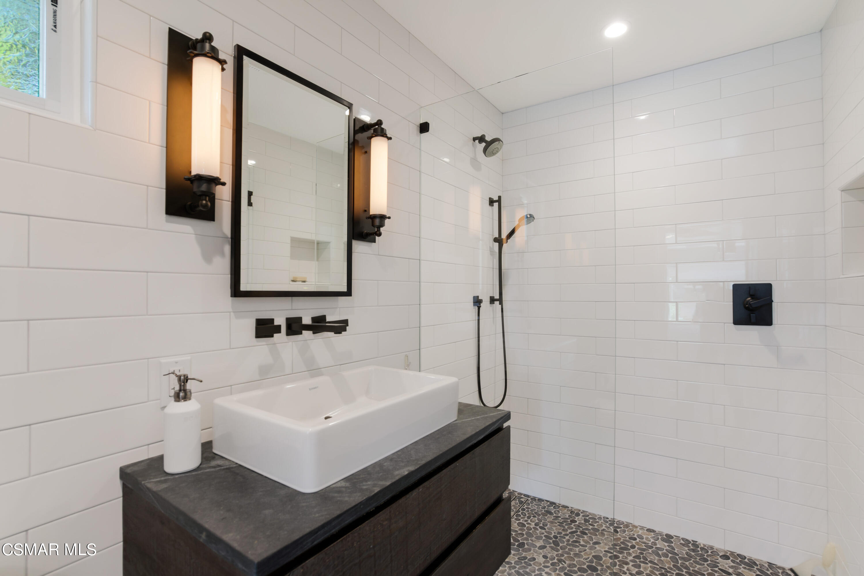 888 Rancho Road Thousand Oaks, CA 91362 - Photo 34 of 44 a bathroom with a sink and a mirror