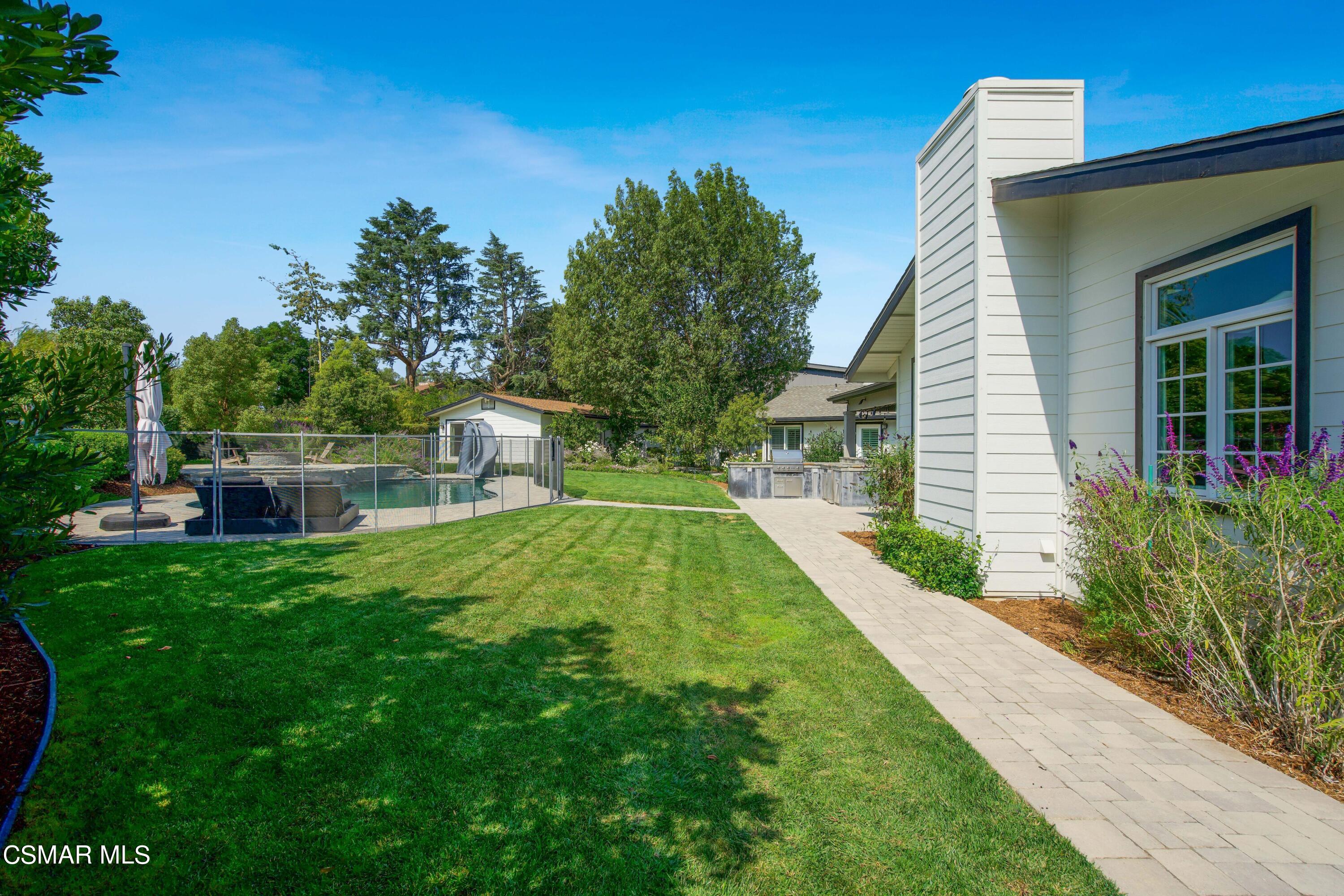 888 Rancho Road Thousand Oaks, CA 91362 - Photo 40 of 44 a view of house with a yard
