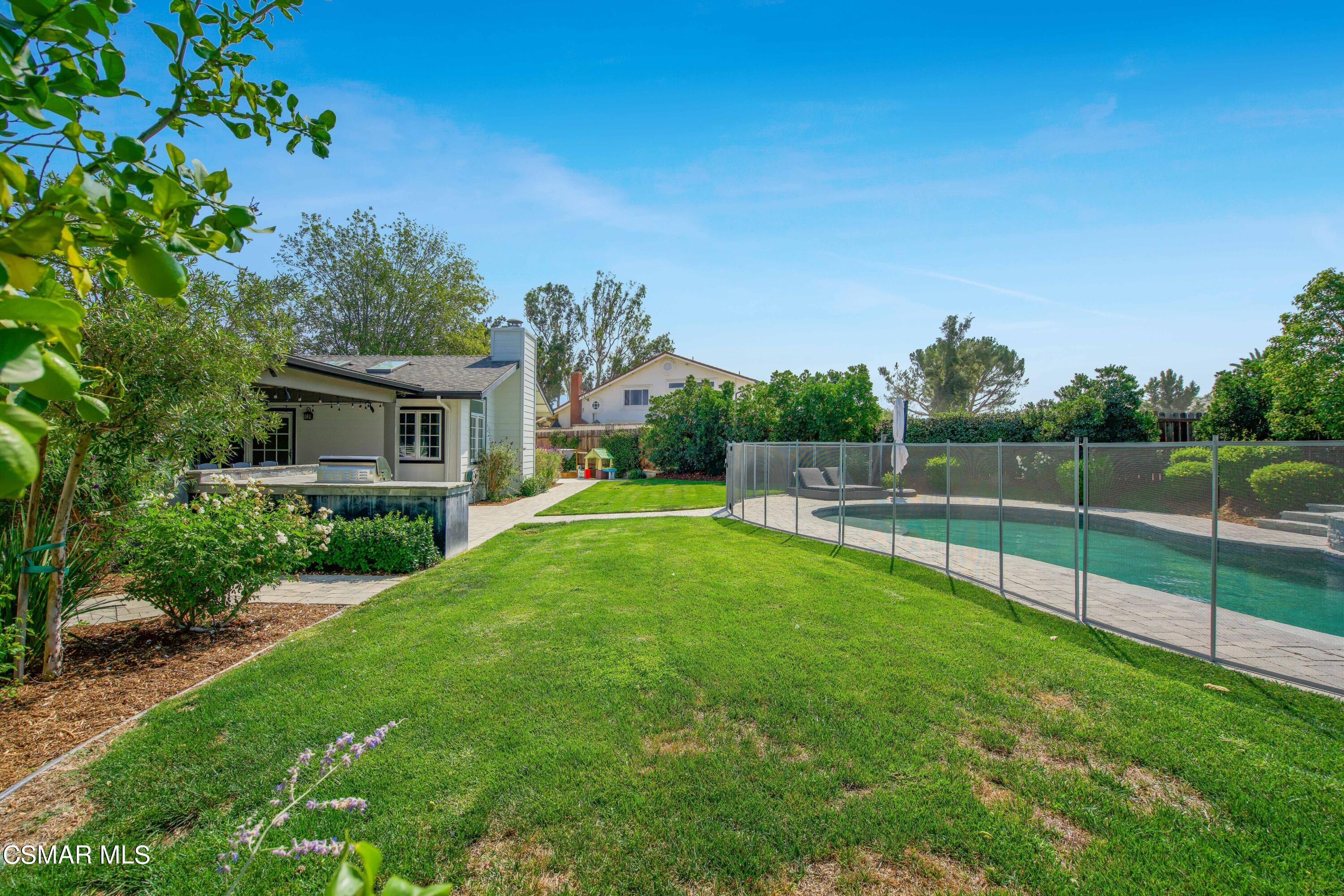 888 Rancho Road Thousand Oaks, CA 91362 - Photo 41 of 44 a view of yard with swimming pool and green space