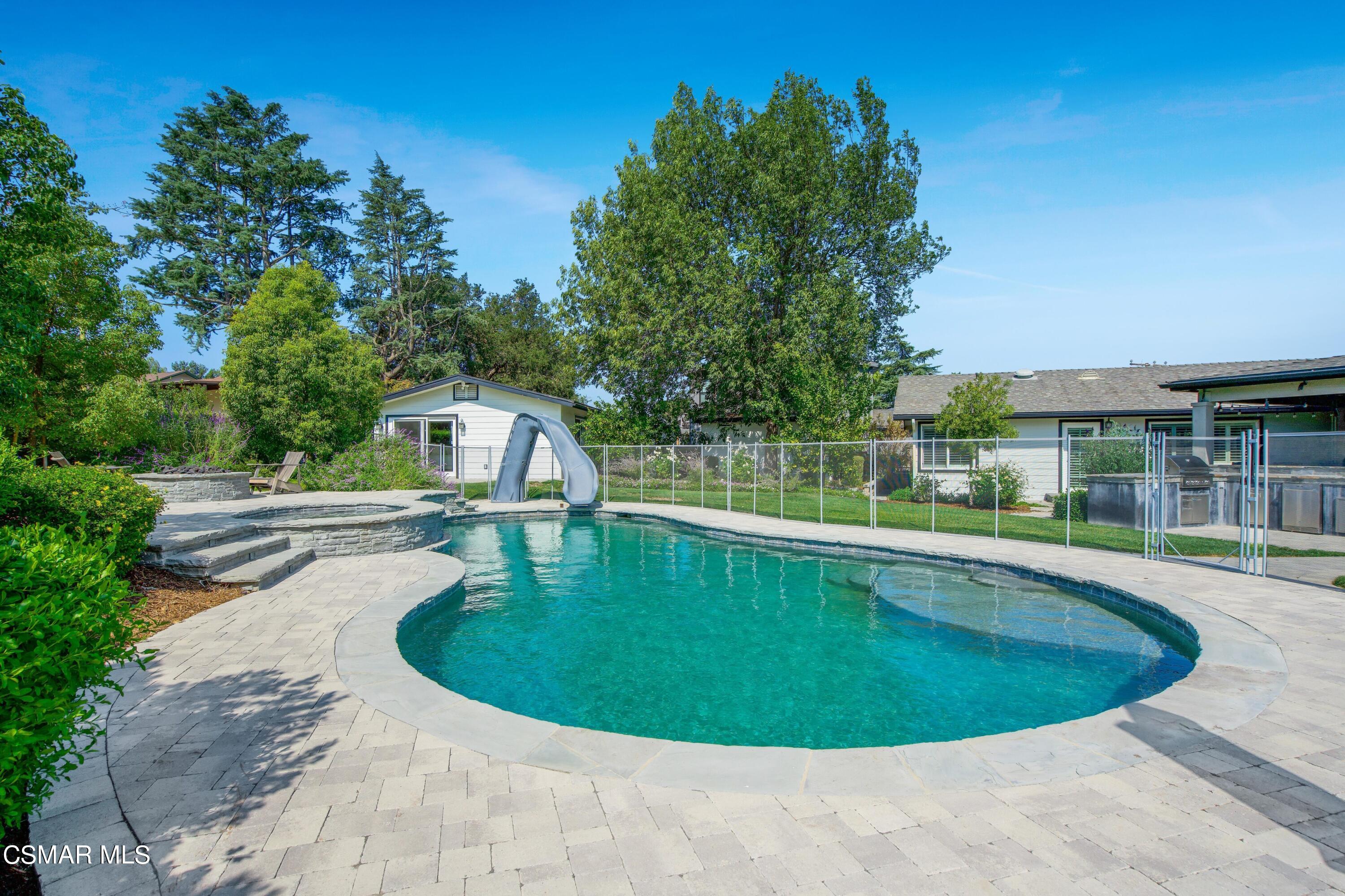 888 Rancho Road Thousand Oaks, CA 91362 - Photo 42 of 44 a view of a swimming pool with a garden