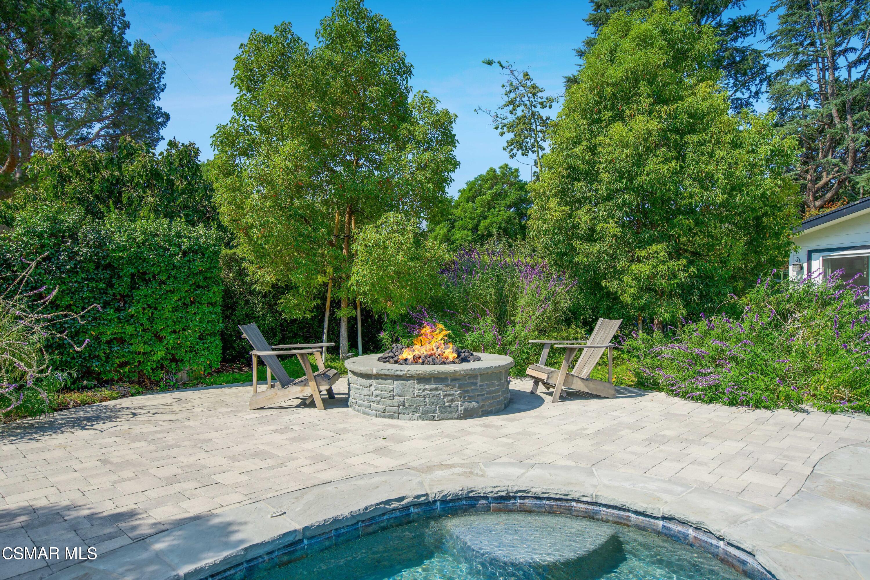 888 Rancho Road Thousand Oaks, CA 91362 - Photo 43 of 44 a backyard of a house with table and chairs