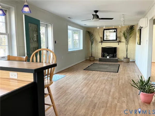 a view of a livingroom with furniture and a fireplace