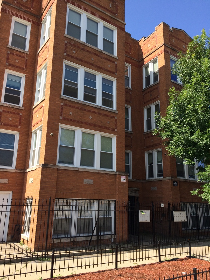 4407 West Adams Street Chicago, IL 60624 - Photo 2 of 10 a front view of a multi story residential apartment building