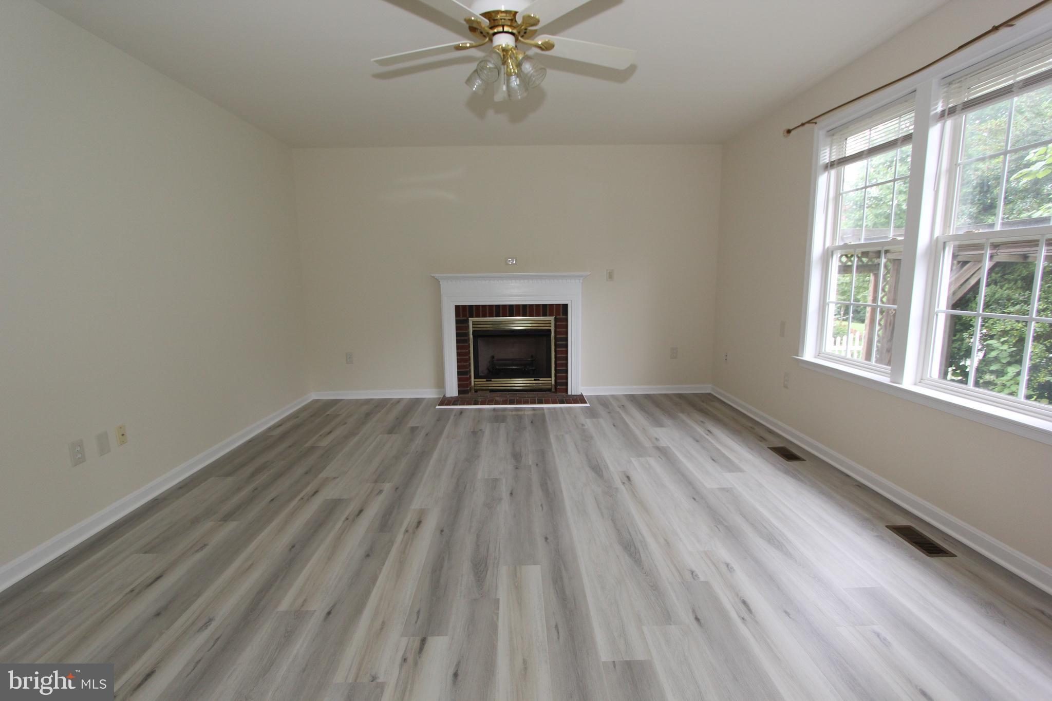 8301 Glen Heather Drive Frederick, MD 21702 - Photo 11 of 72 Huge family room with new floors and gas fireplace