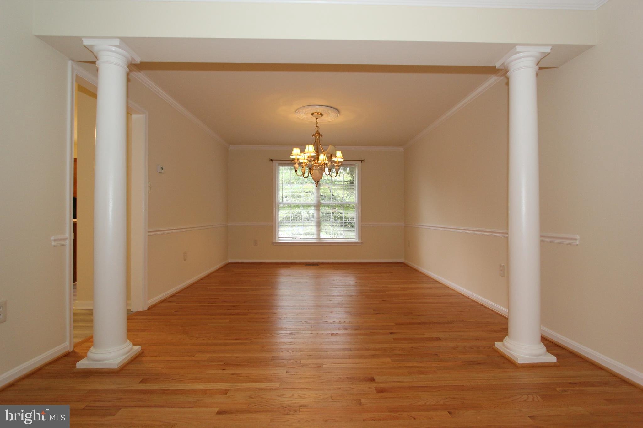 8301 Glen Heather Drive Frederick, MD 21702 - Photo 15 of 72 Formal dining room with decorator columns