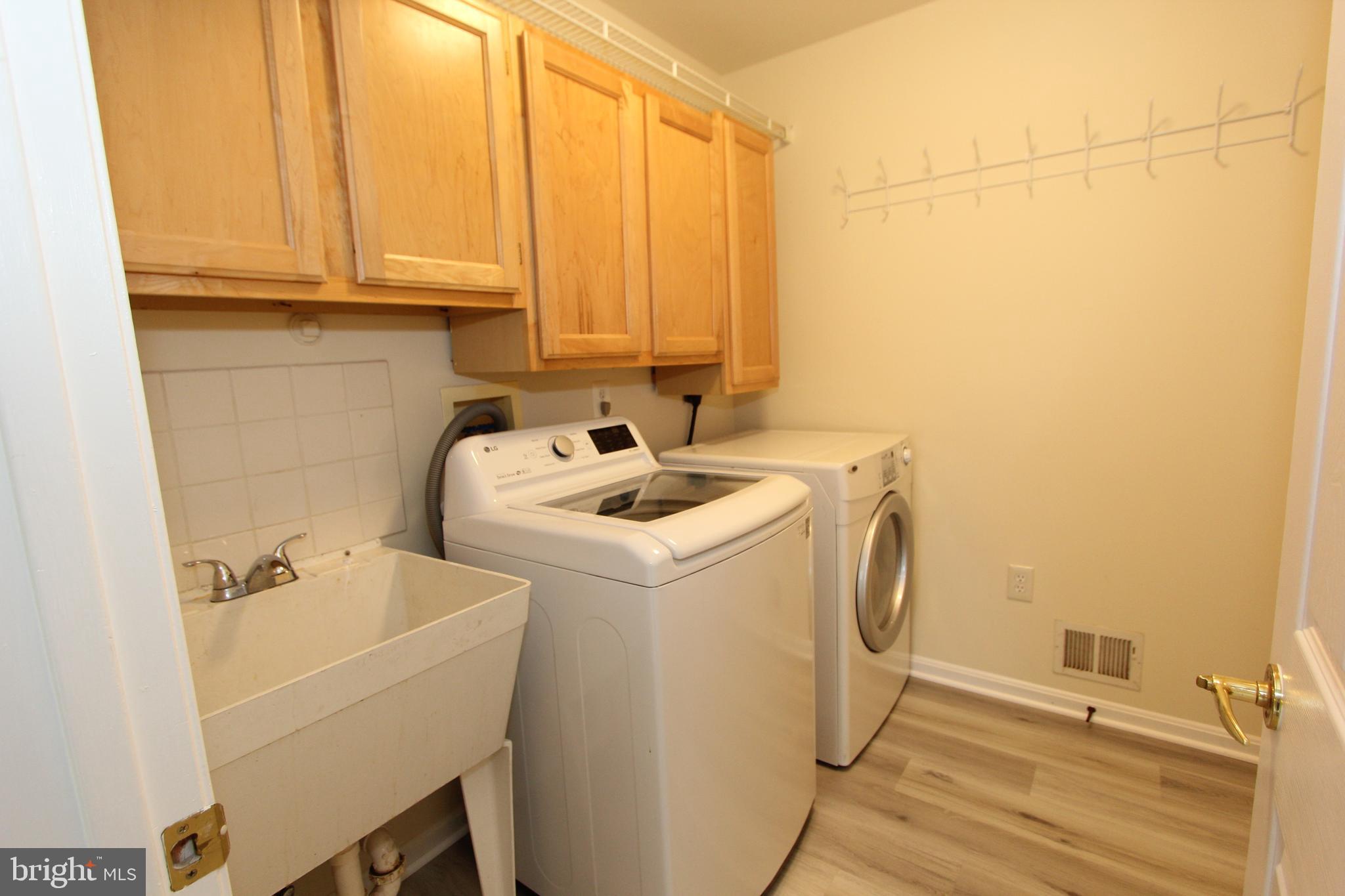 8301 Glen Heather Drive Frederick, MD 21702 - Photo 24 of 72 Main level laundry room with new floors