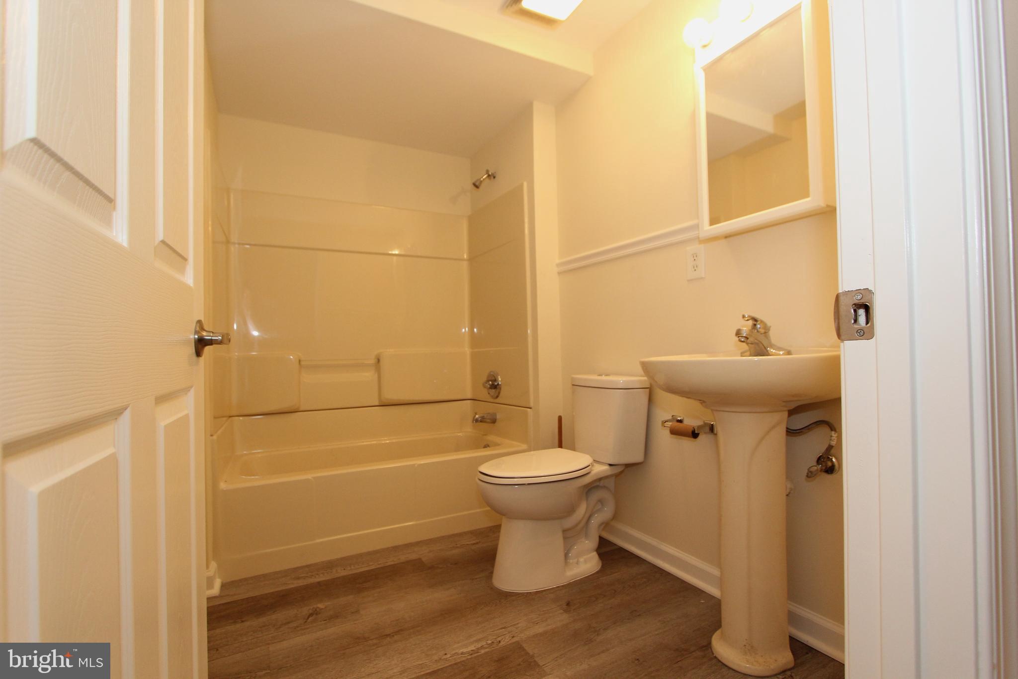 8301 Glen Heather Drive Frederick, MD 21702 - Photo 42 of 72 Lower level full bathroom with plank vinyl floors