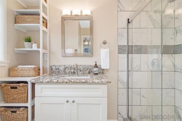 a bathroom with a sink and a mirror
