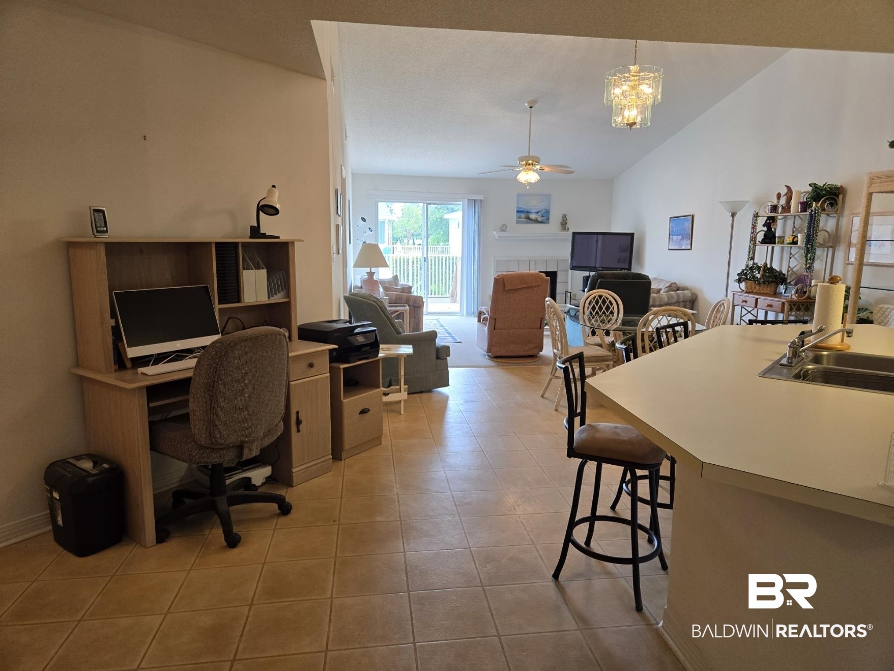 3200 Loop Road, Unit 87 Orange Beach, AL 36561 - Photo 15 of 46 Office with sink, lofted ceiling, light tile patterned floors, and ceiling fan with notable chandelier