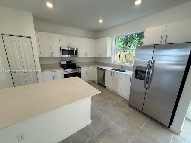 2763 Southeast 26th Road, Unit 2763 Homestead, FL 33035 - Photo 2 of 16 a kitchen with a refrigerator sink and microwave