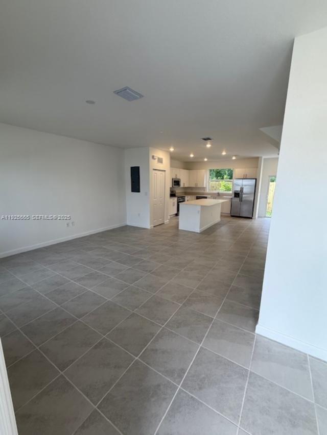 2763 Southeast 26th Road, Unit 2763 Homestead, FL 33035 - Photo 6 of 16 a view of a living room and kitchen