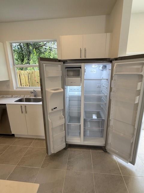 2763 Southeast 26th Road, Unit 2763 Homestead, FL 33035 - Photo 7 of 16 a kitchen with a refrigerator and a stove