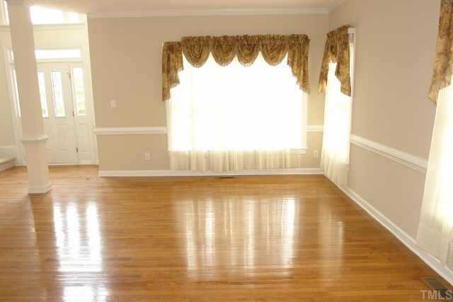 11623 Shavenrock Place Raleigh, NC 27613 - Photo 2 of 10 a view of wooden floor and windows in a room