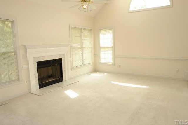11623 Shavenrock Place Raleigh, NC 27613 - Photo 6 of 10 a view of empty room with a fireplace