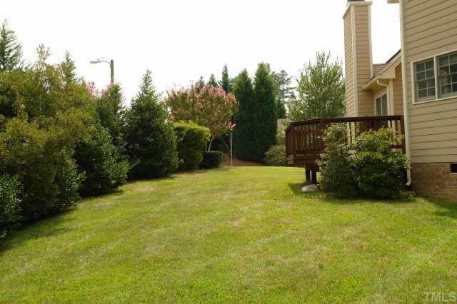 11623 Shavenrock Place Raleigh, NC 27613 - Photo 10 of 10 a view of a garden with a chair