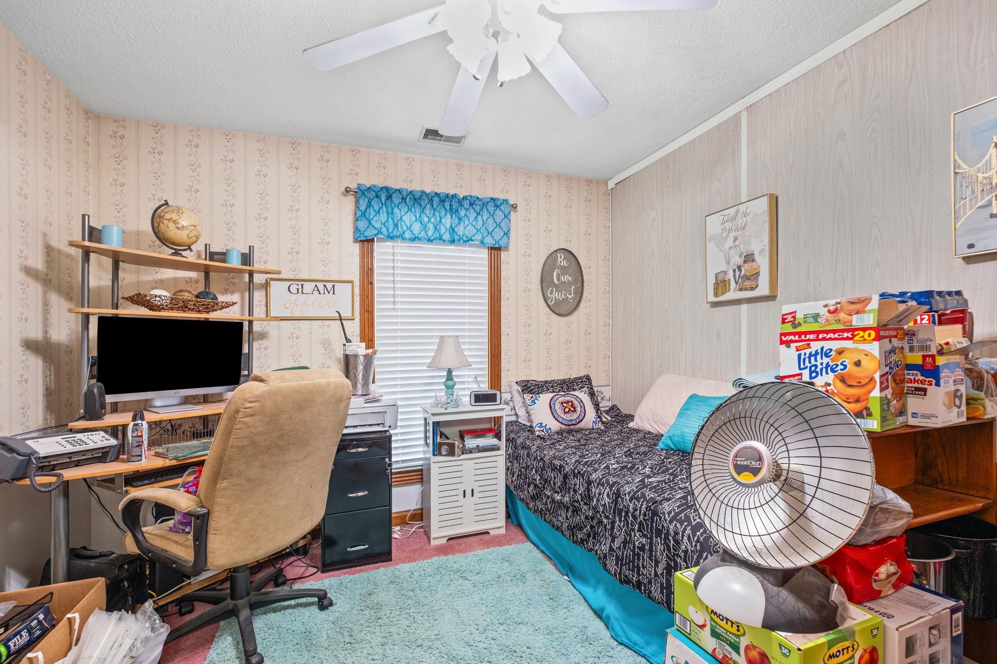 4572 Benoit Drive Memphis, TN 38141 - Photo 11 of 25 a work room with furniture and a window