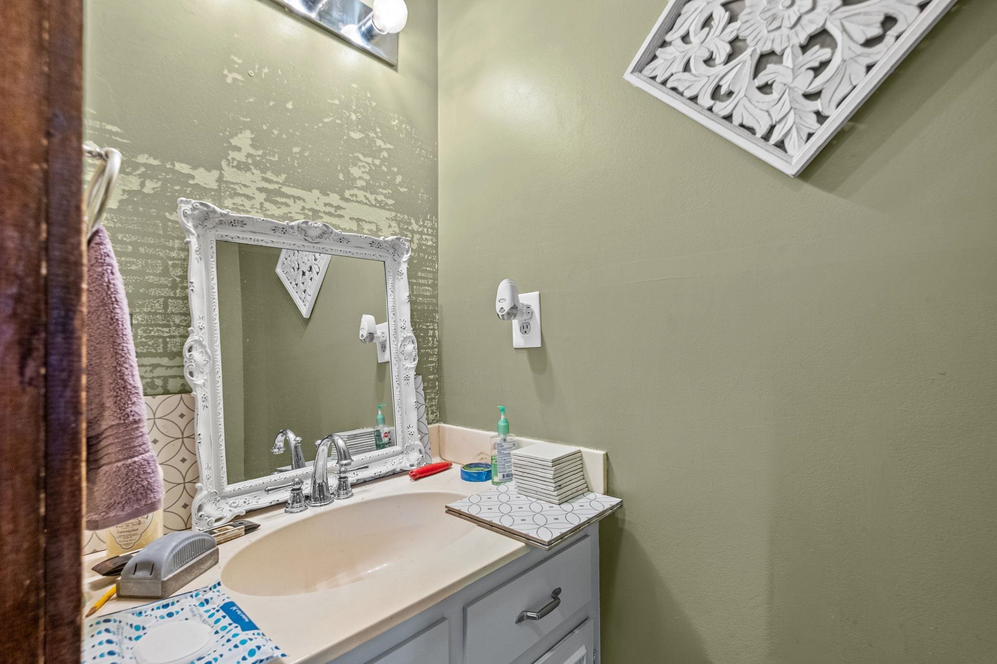 4572 Benoit Drive Memphis, TN 38141 - Photo 12 of 25 a bathroom with a sink vanity and a mirror