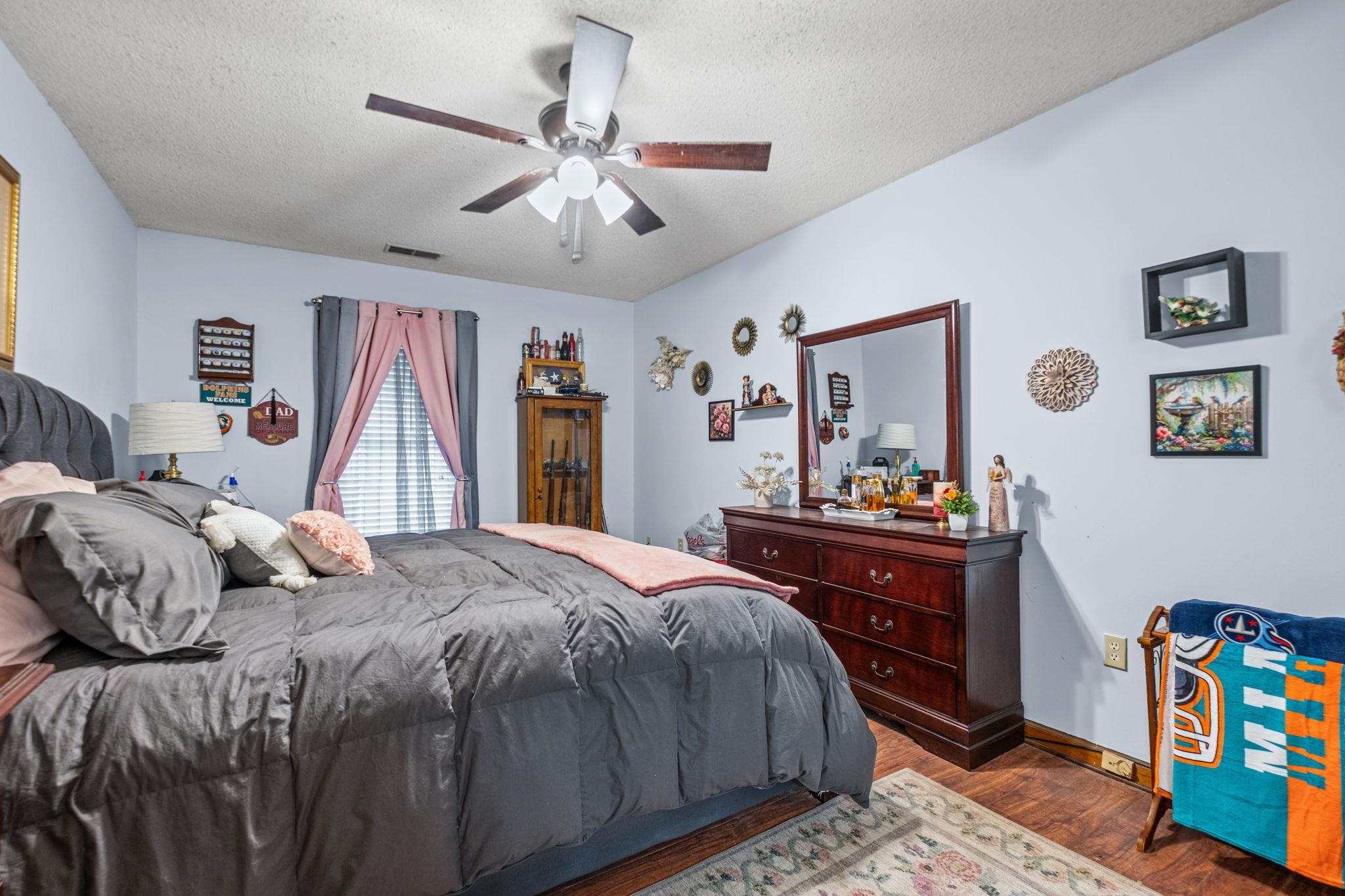 4572 Benoit Drive Memphis, TN 38141 - Photo 13 of 25 a bedroom with a bed and a dresser in it