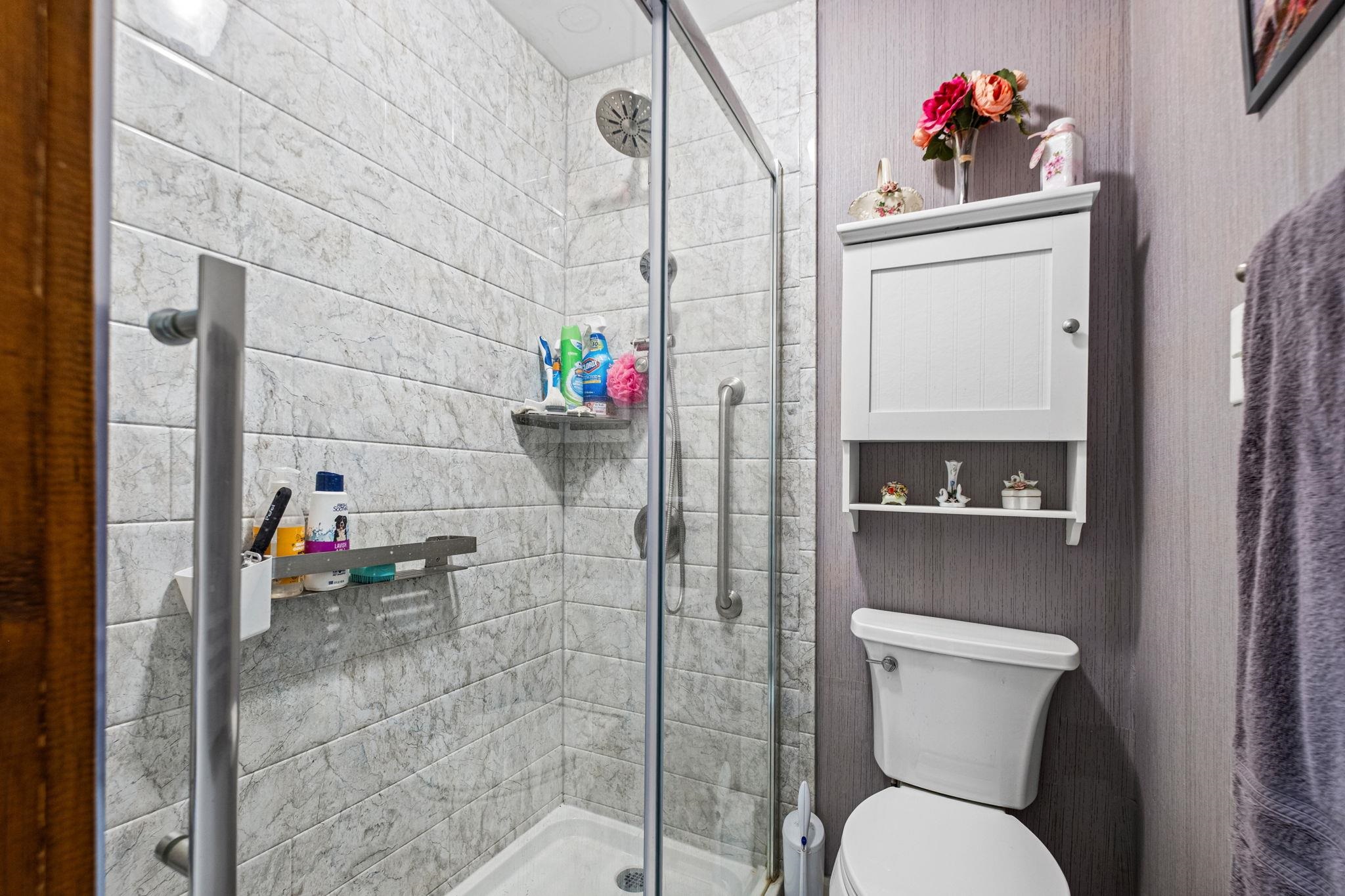 4572 Benoit Drive Memphis, TN 38141 - Photo 15 of 25 a bathroom with a toilet and a shower
