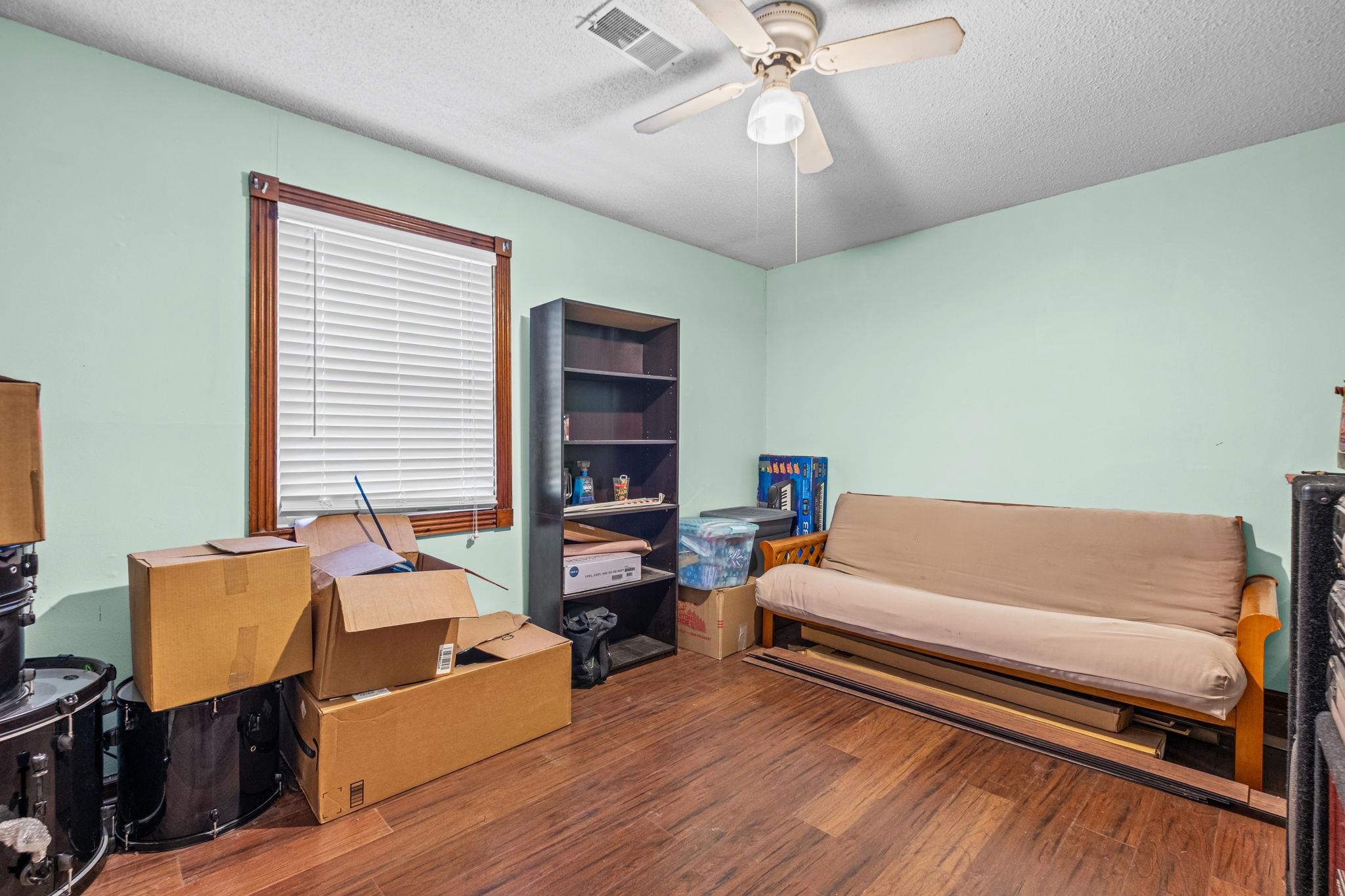 4572 Benoit Drive Memphis, TN 38141 - Photo 16 of 25 a living room with furniture and a window