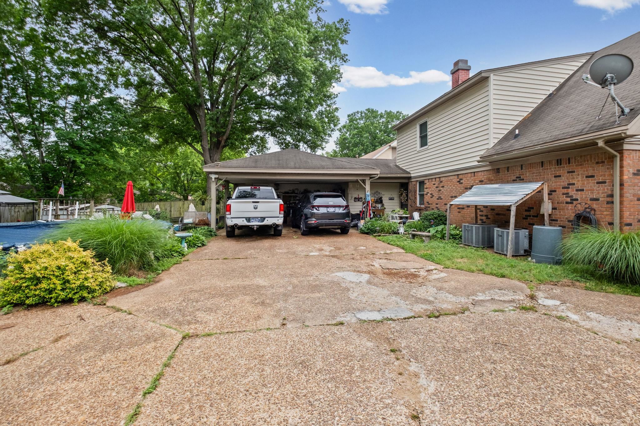 4572 Benoit Drive Memphis, TN 38141 - Photo 20 of 25 a car parked in front of house with a yard