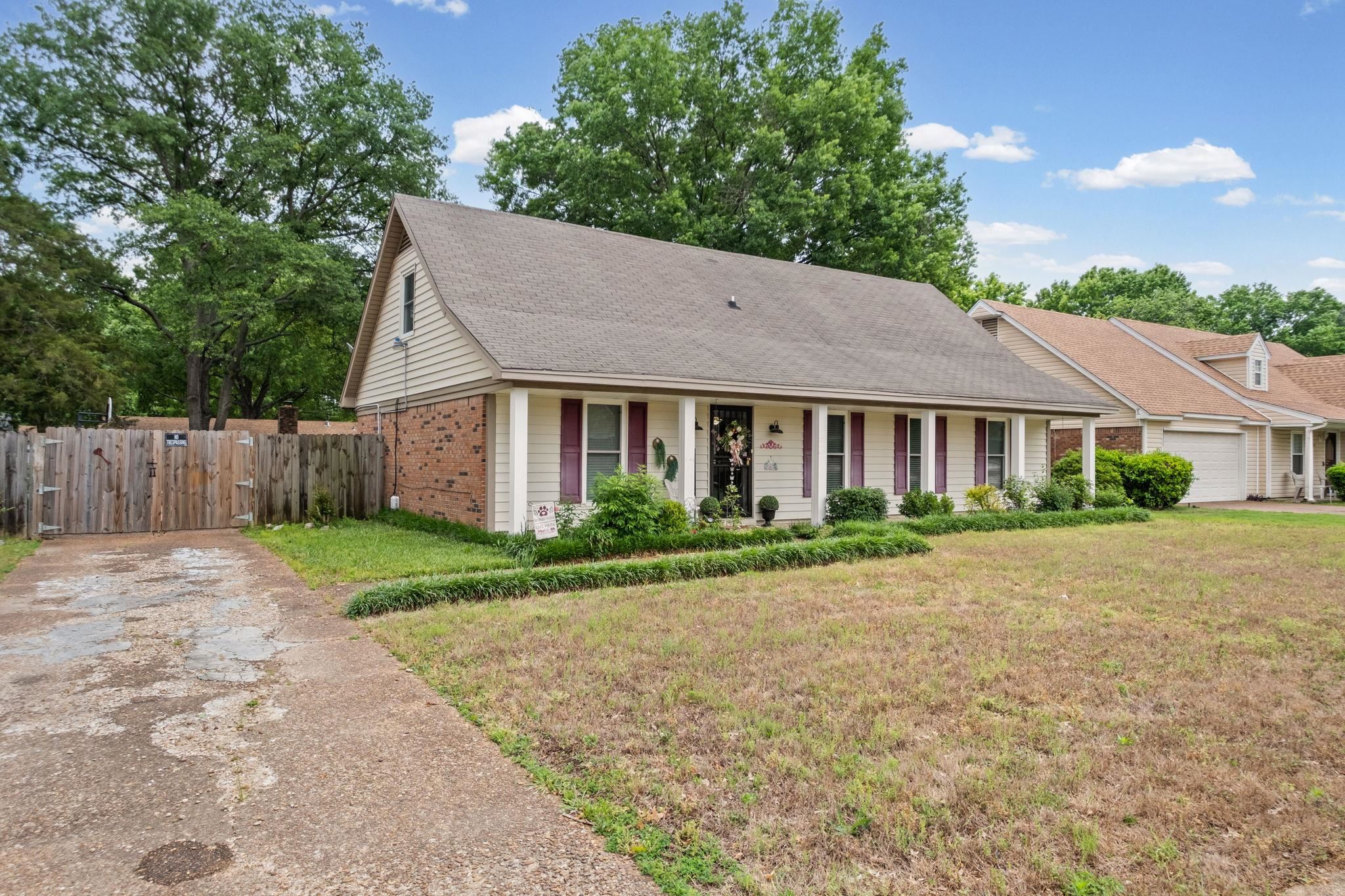 4572 Benoit Drive Memphis, TN 38141 - Photo 2 of 25 a front view of a house with a yard and garage