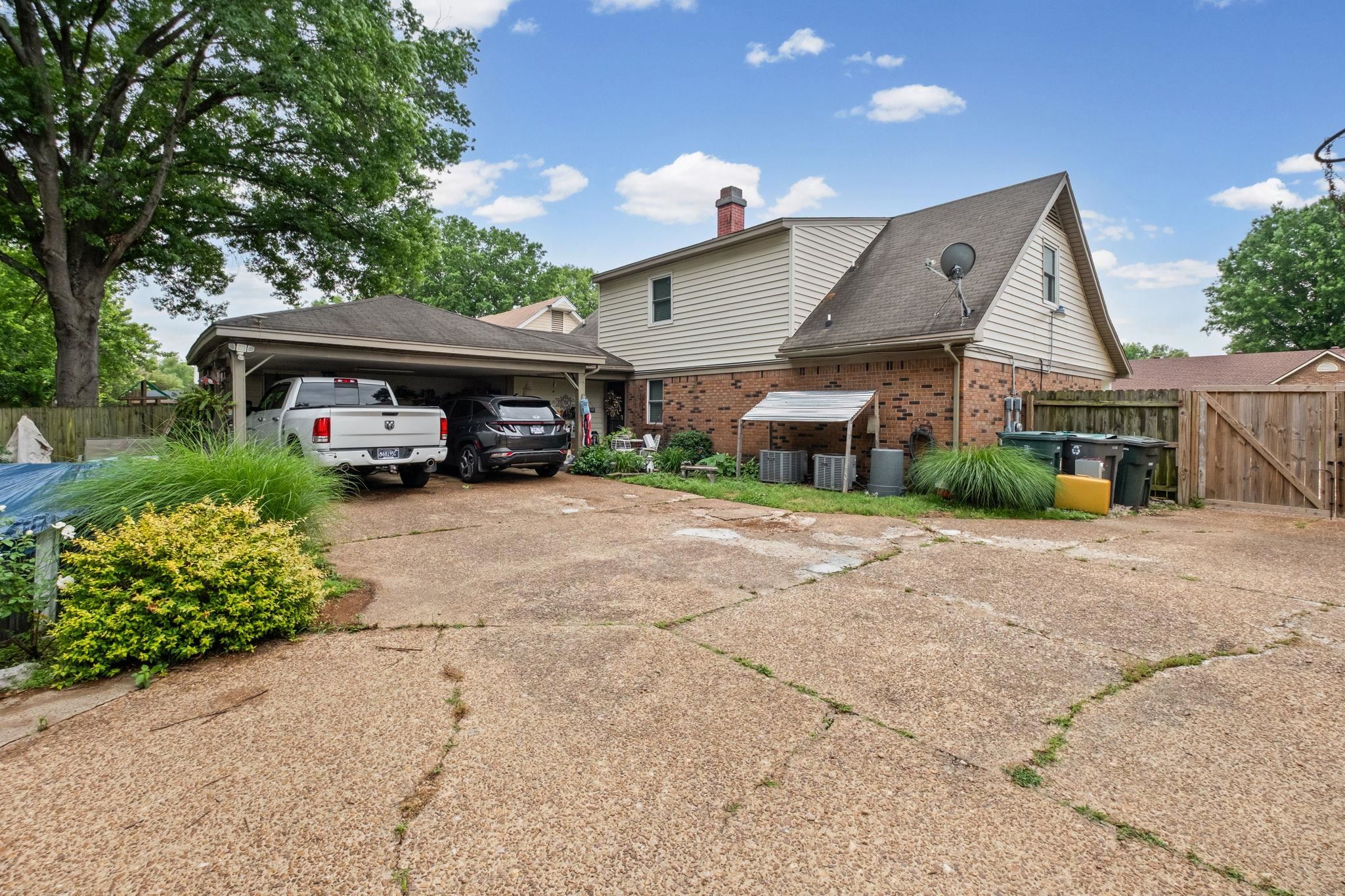 4572 Benoit Drive Memphis, TN 38141 - Photo 21 of 25 front view of a house with a yard