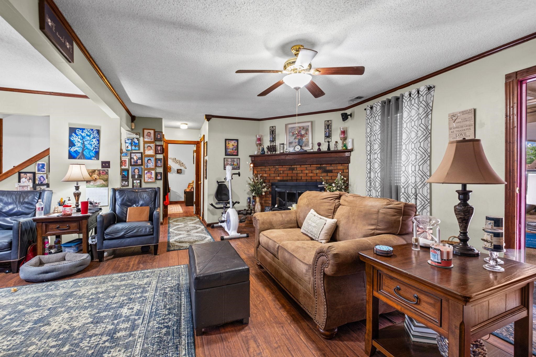 4572 Benoit Drive Memphis, TN 38141 - Photo 5 of 25 a living room with furniture and a fireplace