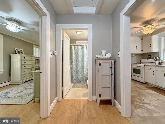 a kitchen with a white cabinets and white appliances
