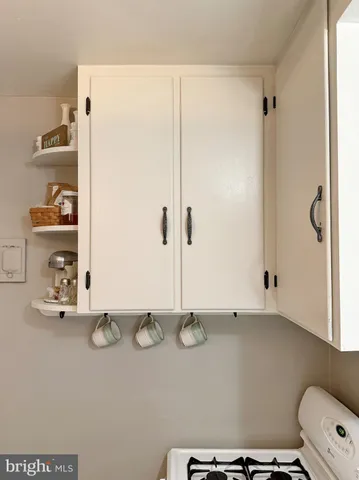 a kitchen with a stove and cabinets