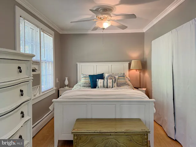 a bed room with a bed and a dresser