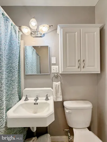 a storage room with a bed and cabinets