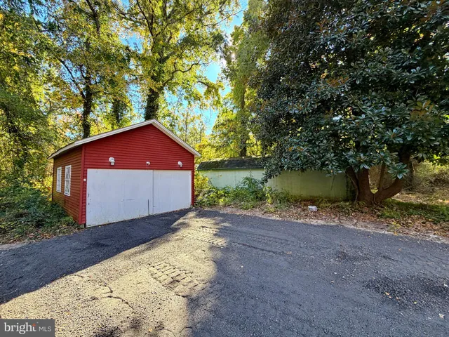 a pathway of a house with a yard