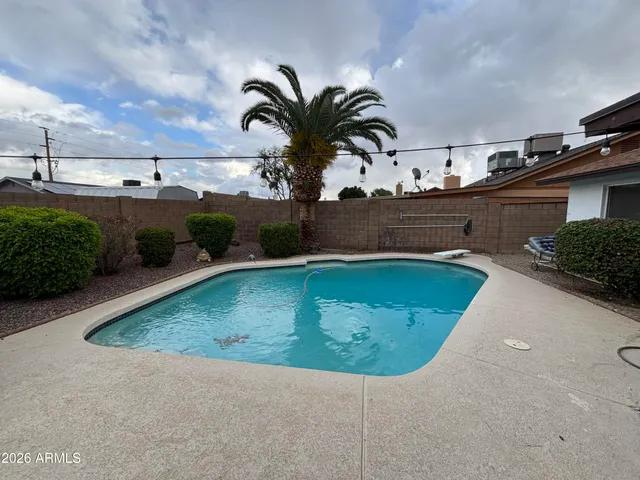 a view of a patio with table and chairs potted plants with wooden floor