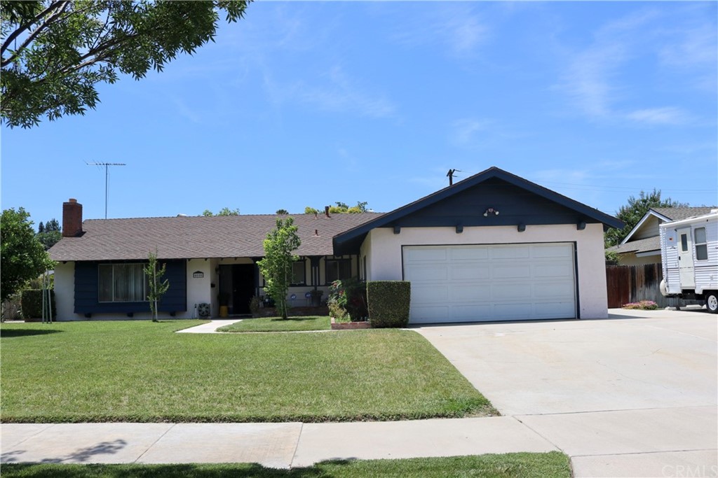4080 Stotts Street Riverside, CA 92503 - Photo 1 of 1 a front view of a house with a yard and garage