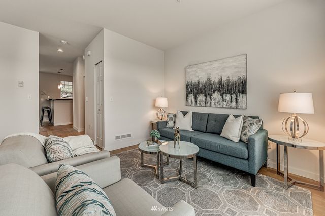 a bathroom with a sink mirror vanity and toilet